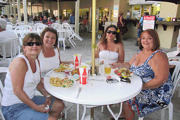 People enjoying a meal at the Anna Maria Island Beach Cafe