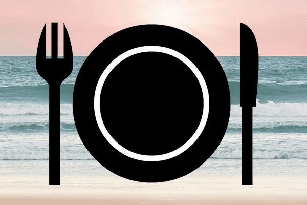 image of a dinner plate over a beach near sunset